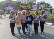 Tim Cooling System Ditlantas Polda Riau Gelar Kampanye Keselamatan Berlalu Lintas dan Himbauan Pilkada Riau di Area CFD Pekanbaru