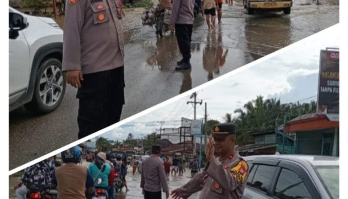 Kapolsek Rambah Hilir Lakukan Pengamanan dan Pengaturan Lalu Lintas Akibat Luapan Banjir